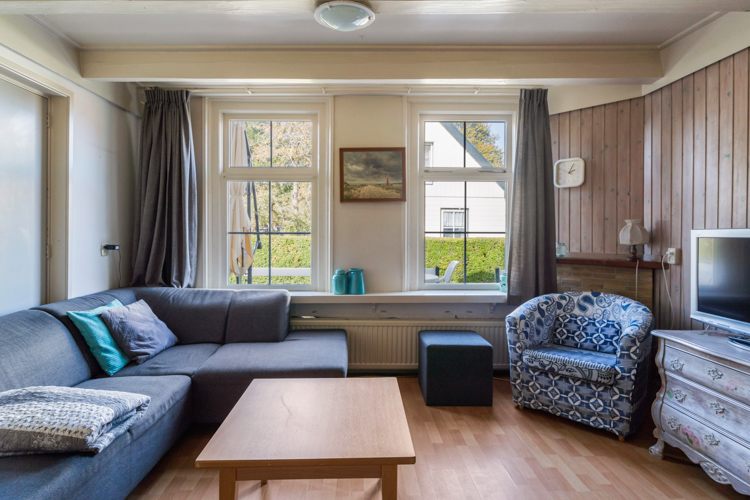 Vakantiehuisje Even Bykomme woonkamer zithoek