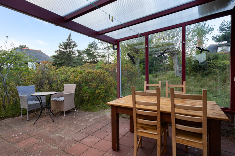 Winterkoning vakantiehuis Schiermonnikoog terras overdekt binnen-buiten